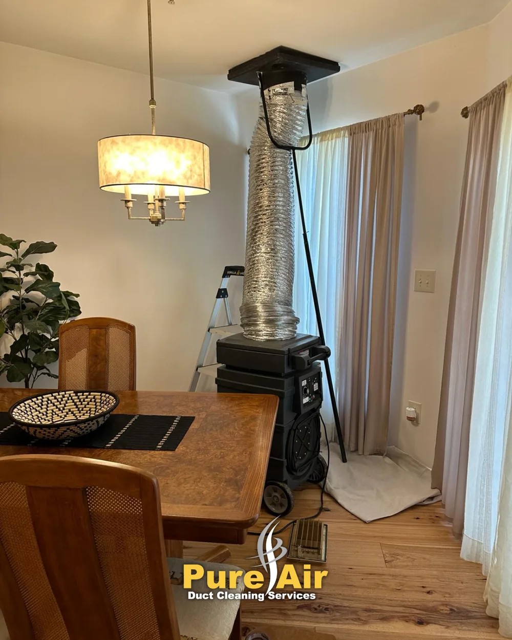 HEPA air duct cleaning equipment set up in a dining room