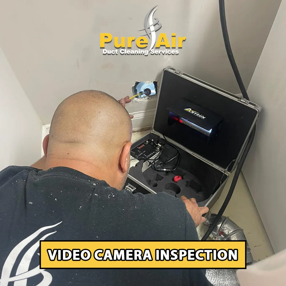 Technician performing a video camera inspection of air ducts