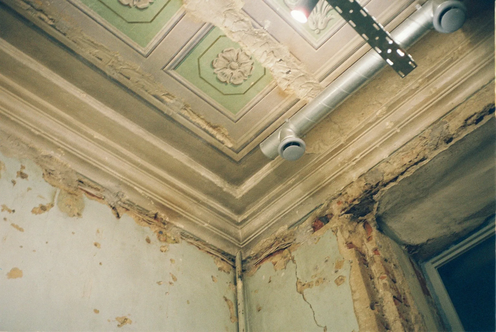Mold and water damage on a ceiling and wall